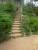 escaliers en demis - rondins de 16 cm avec piquets plantés devant